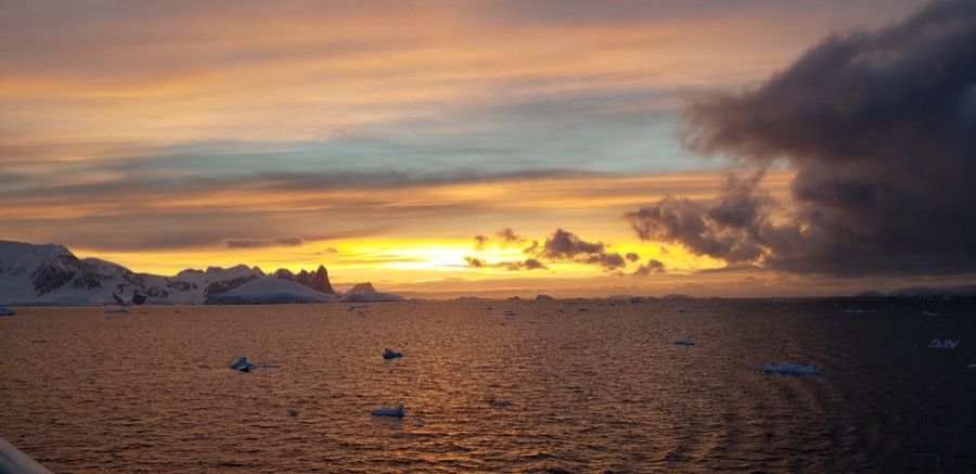 A orange and pink sky in Antarctica at sunset