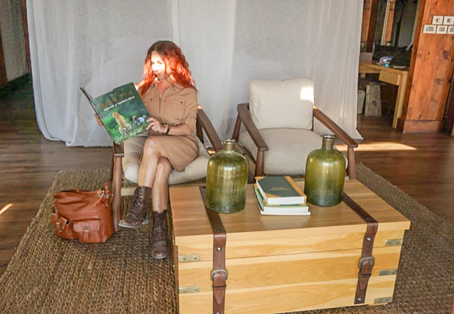 Women in safari lodge reading