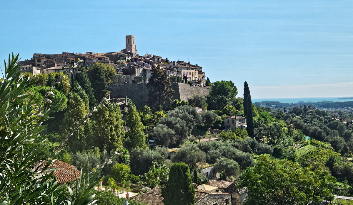 Old town surrounded by a stone wall perched on a hilltop in southern France